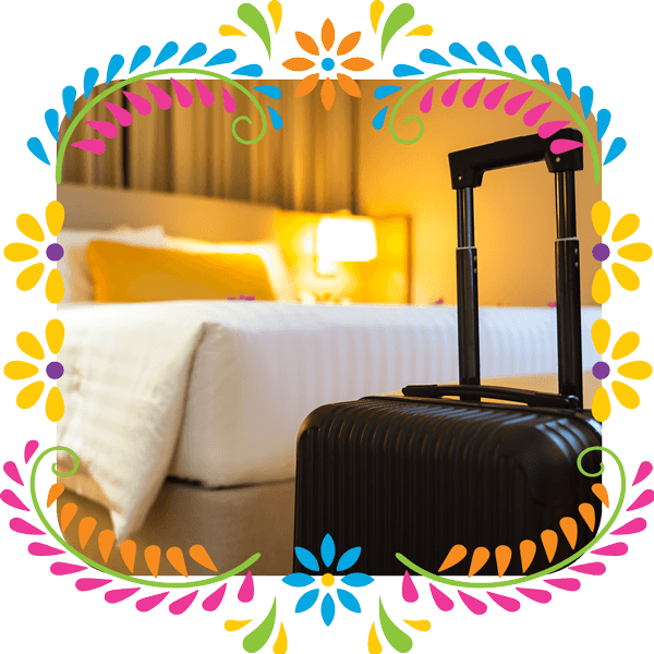 Congress-Housing-Hotel-Luggage Photo of luggage in a hotel room in a flower border